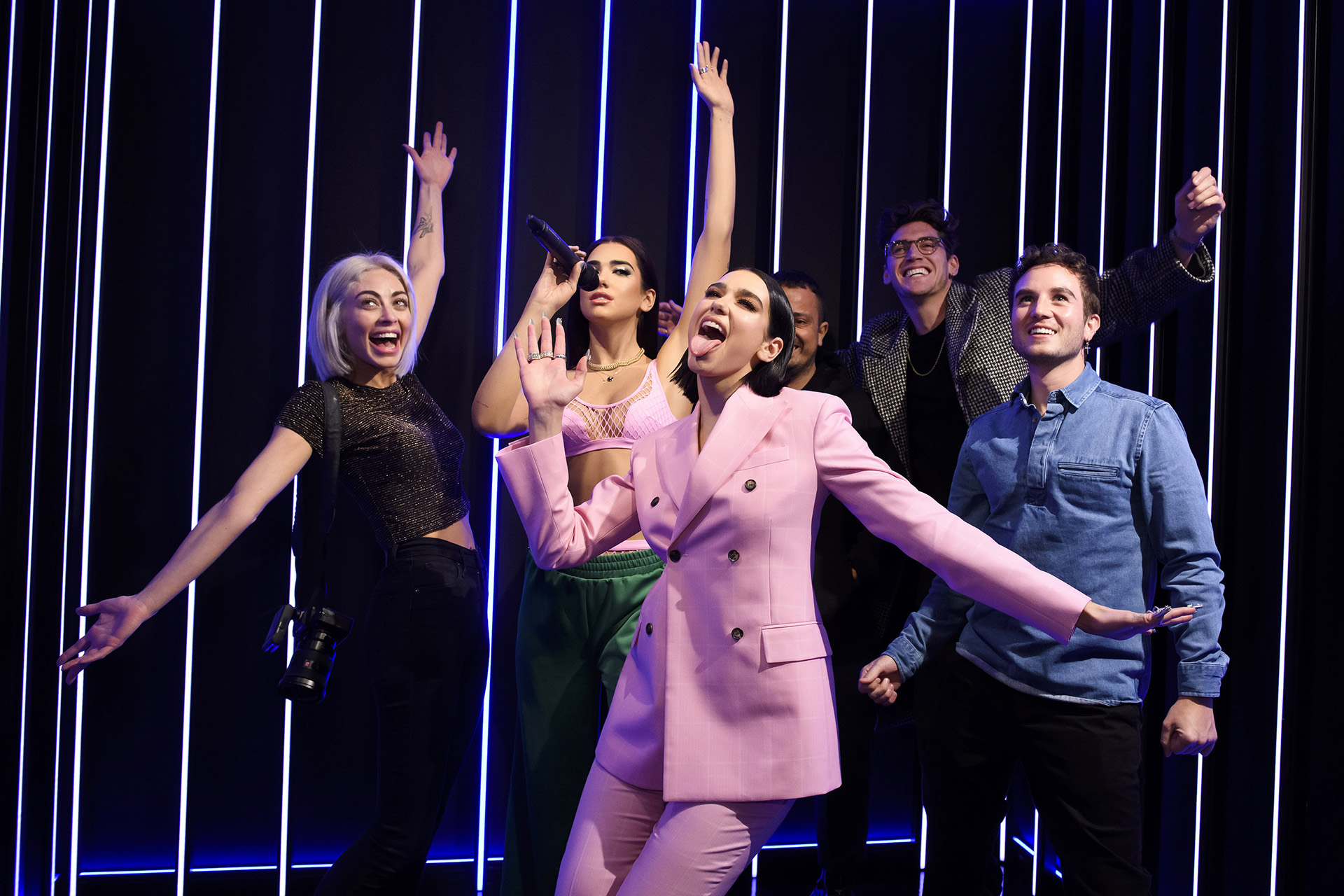 Dua Lipa with her figure and fans at Madame Tussauds